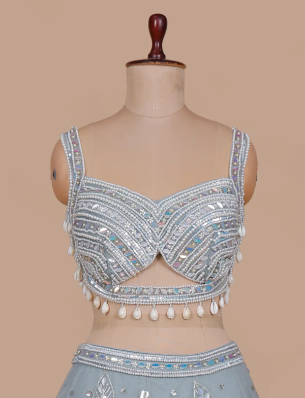Powder Blue Designer Blouse with Pearl Embroidery in USA Graceful Powder Blue Lehenga with Pearl Accents in USA Front View Blouse
